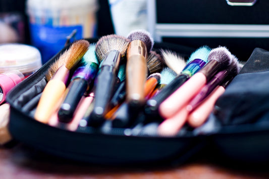 makeup brushes on black round plate