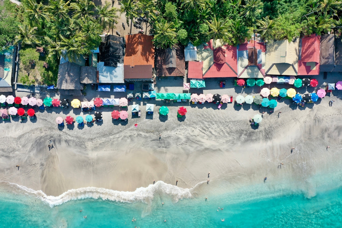 people swimming on beach during daytime
