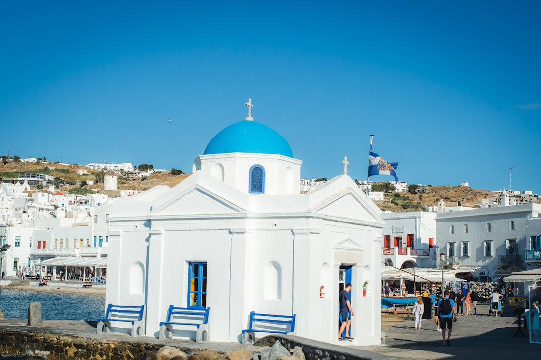 white and brown concrete church under blue sky during daytime