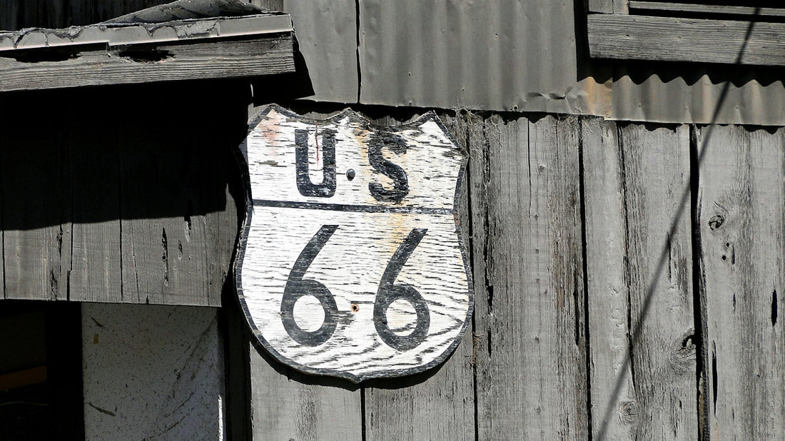 A sign on the side of a wooden building