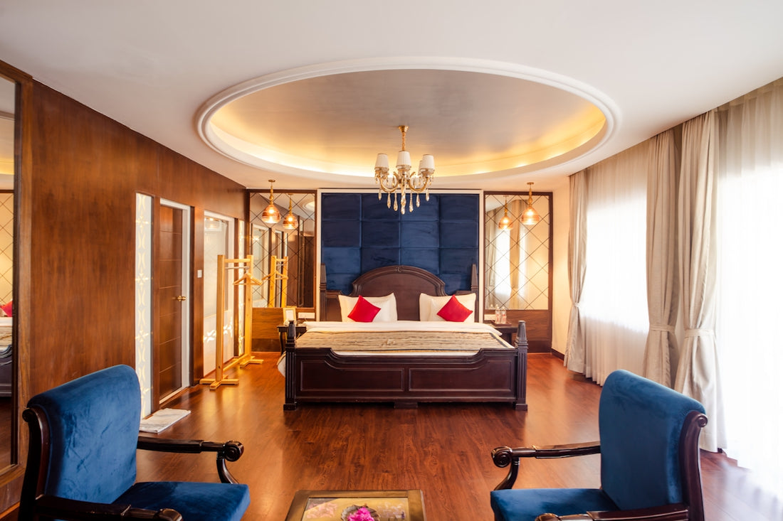 Luxurious bedroom boasts a large bed and elegant decor.