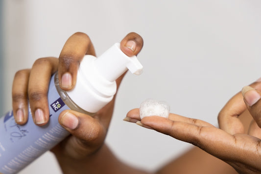 Hand dispensing foam product onto fingertip