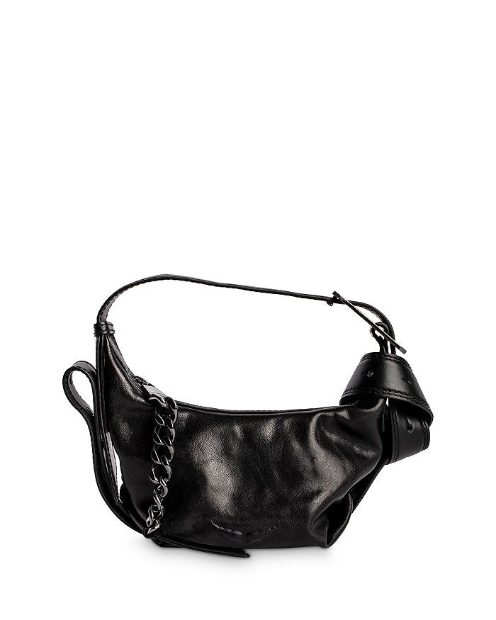 a black and white photo of a purse 