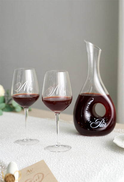 a group of wine glasses on a table 