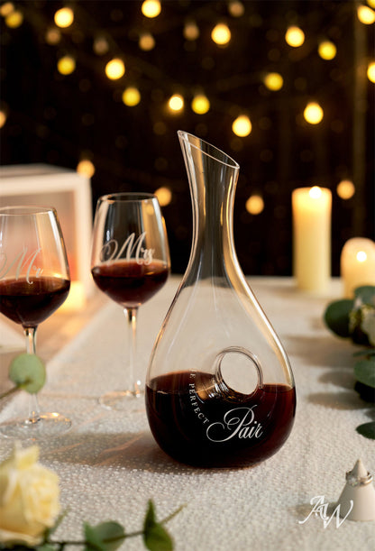 a glass of wine sitting on top of a table 
