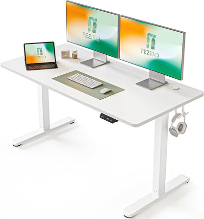 a laptop computer sitting on top of a desk 