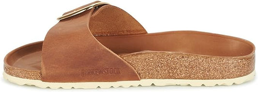 a close up of a pair of shoes on a surfboard 