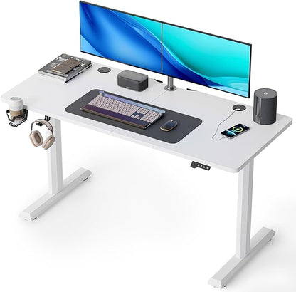 a laptop computer sitting on top of a desk 