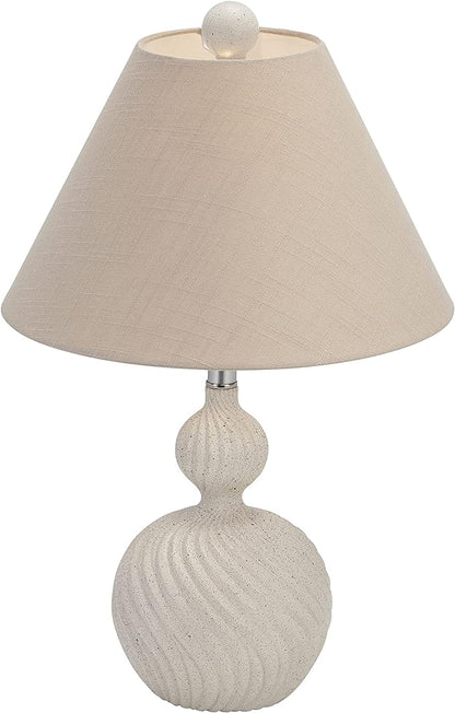 a lamp that is on a table next to a lamp 