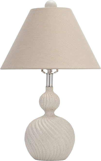 a lamp that is on a table next to a lamp 