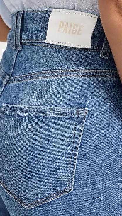 a person sitting on a couch holding a skateboard 