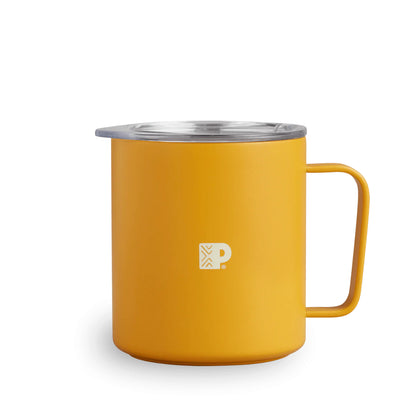 a yellow cup sitting on top of a table 