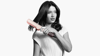a woman holding a baseball bat in her hands 