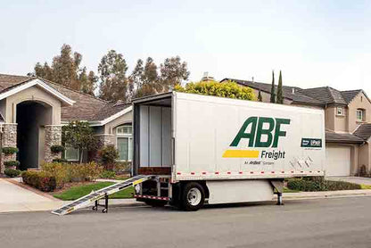 a white truck parked in front of a house 