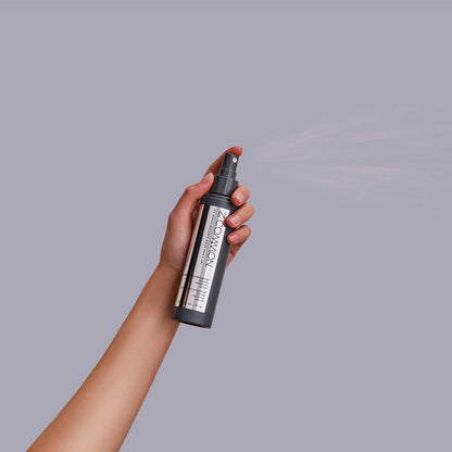 a person holding a cell phone in their hand 