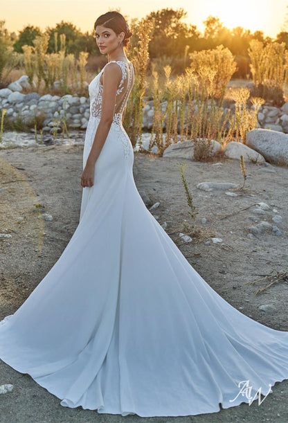 a man standing on a beach holding a kite 