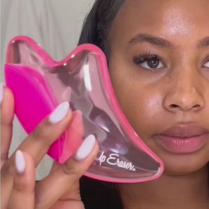 a woman holding a pink toothbrush in her mouth 